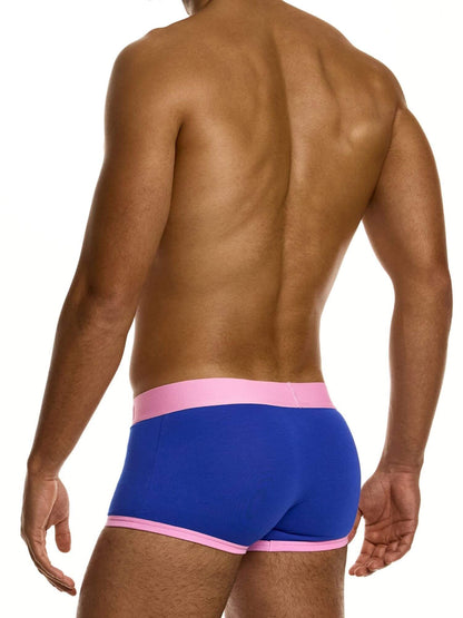 Man wearing blue underwear with pink waistband on a white background
