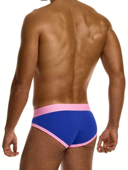 Man wearing blue briefs with pink waistband on a white background