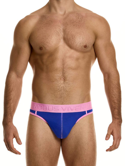 Man wearing blue and pink underwear with a visible brand logo on a white background