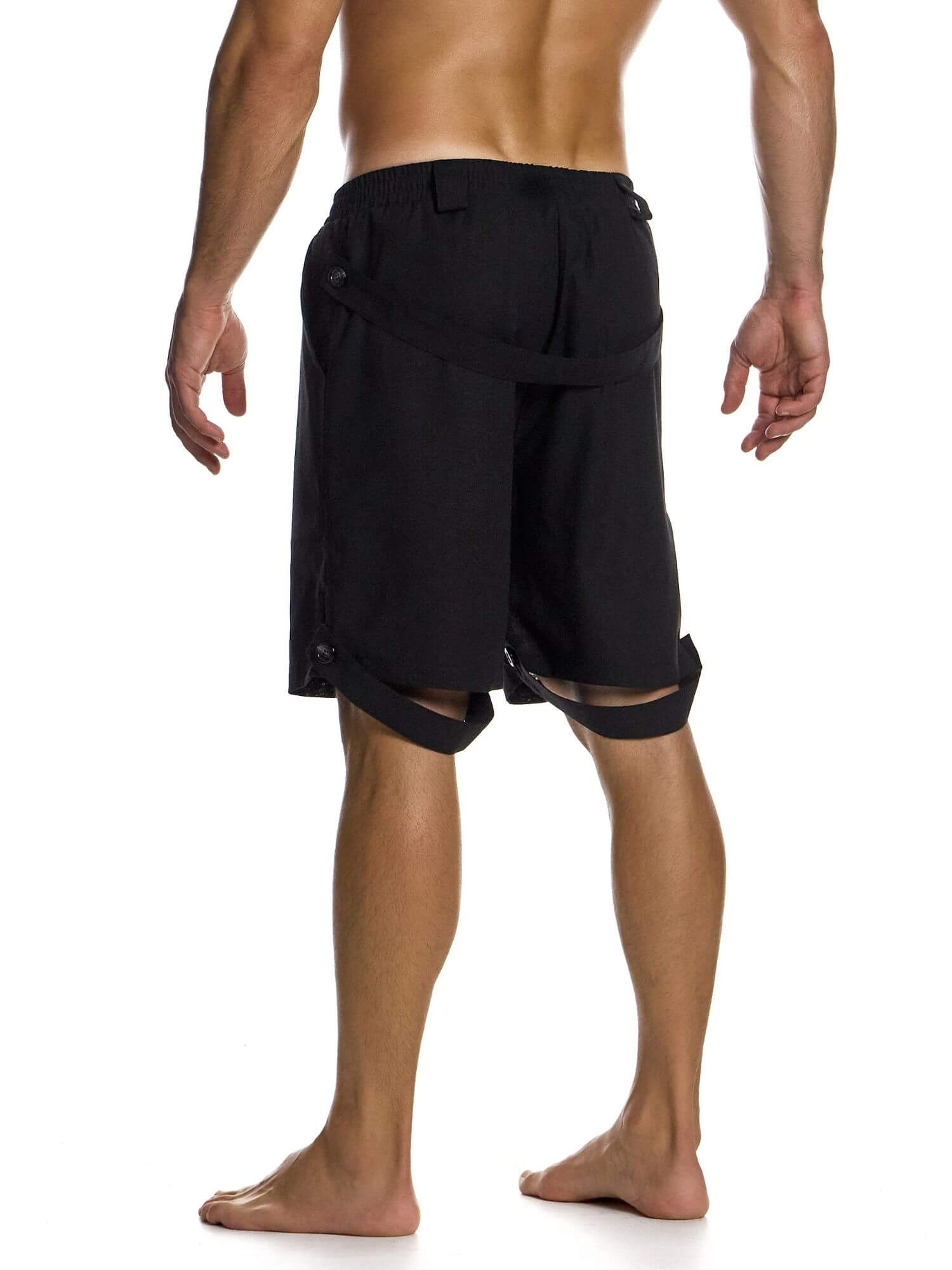 Black shorts worn by a person on a white background