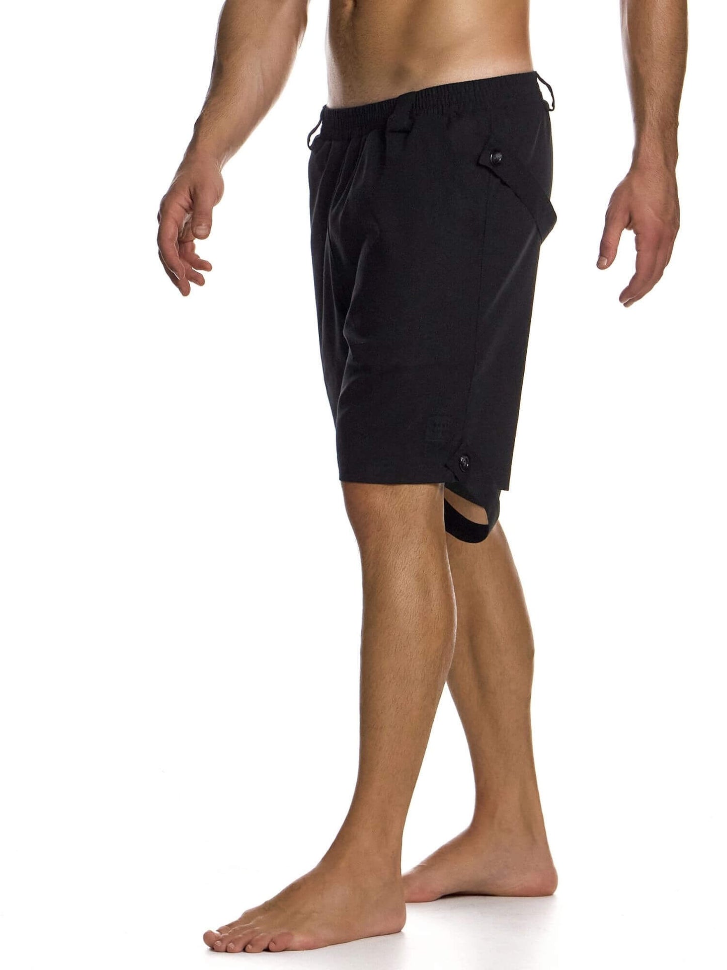 Black shorts worn by a person on a white background