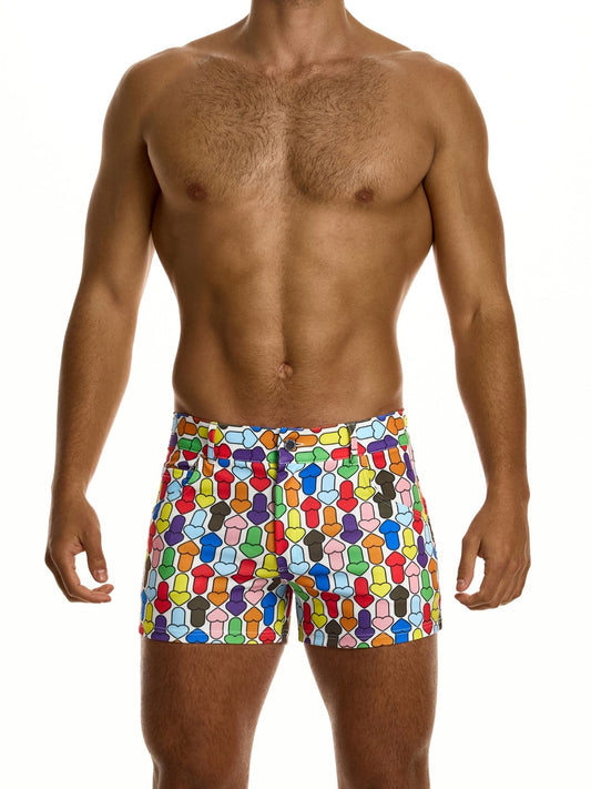 Man wearing colorful geometric patterned shorts on a white background