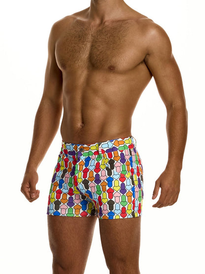 Man wearing colorful geometric patterned shorts on a white background