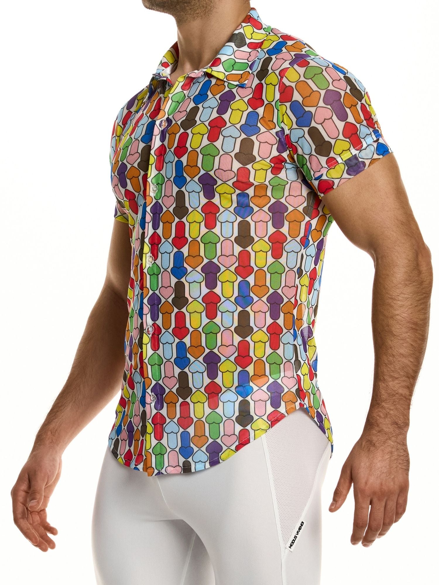 Man wearing a colorful geometric patterned shirt on a white background