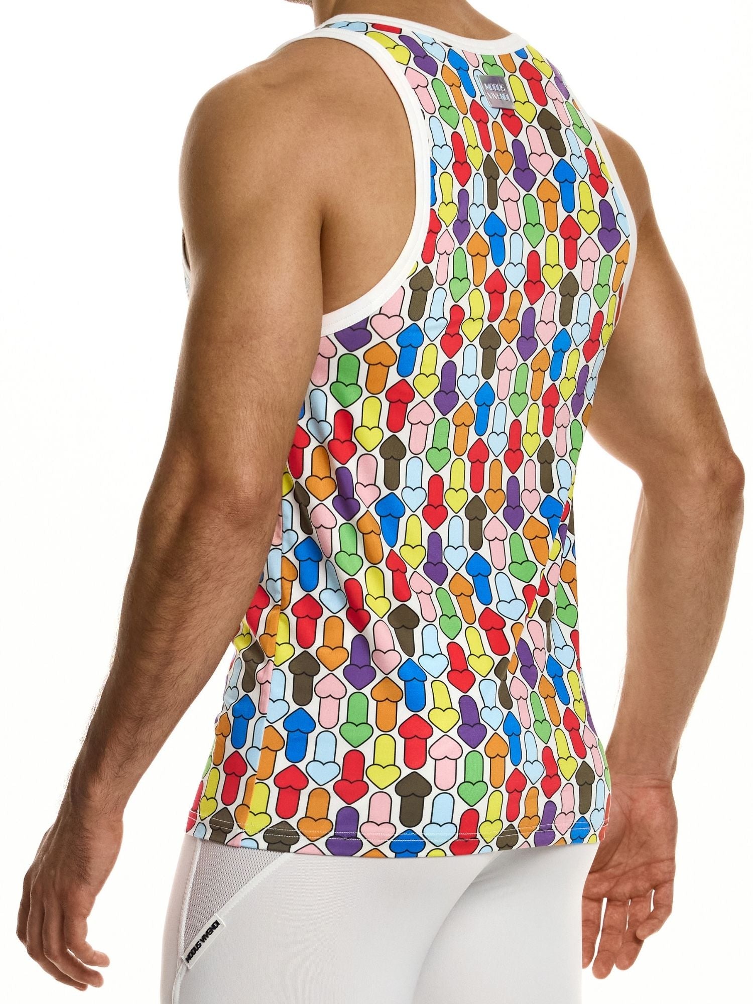 Colorful geometric patterned tank top worn by a person on a white background