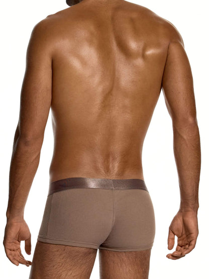 Rear view of a man wearing brown men's briefs against a white background.