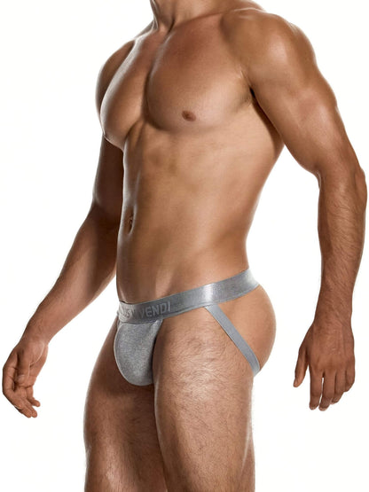 A muscular male model wearing a silver metallic jockstrap with a visible Vendi brand logo on the waistband, set against a plain white background.