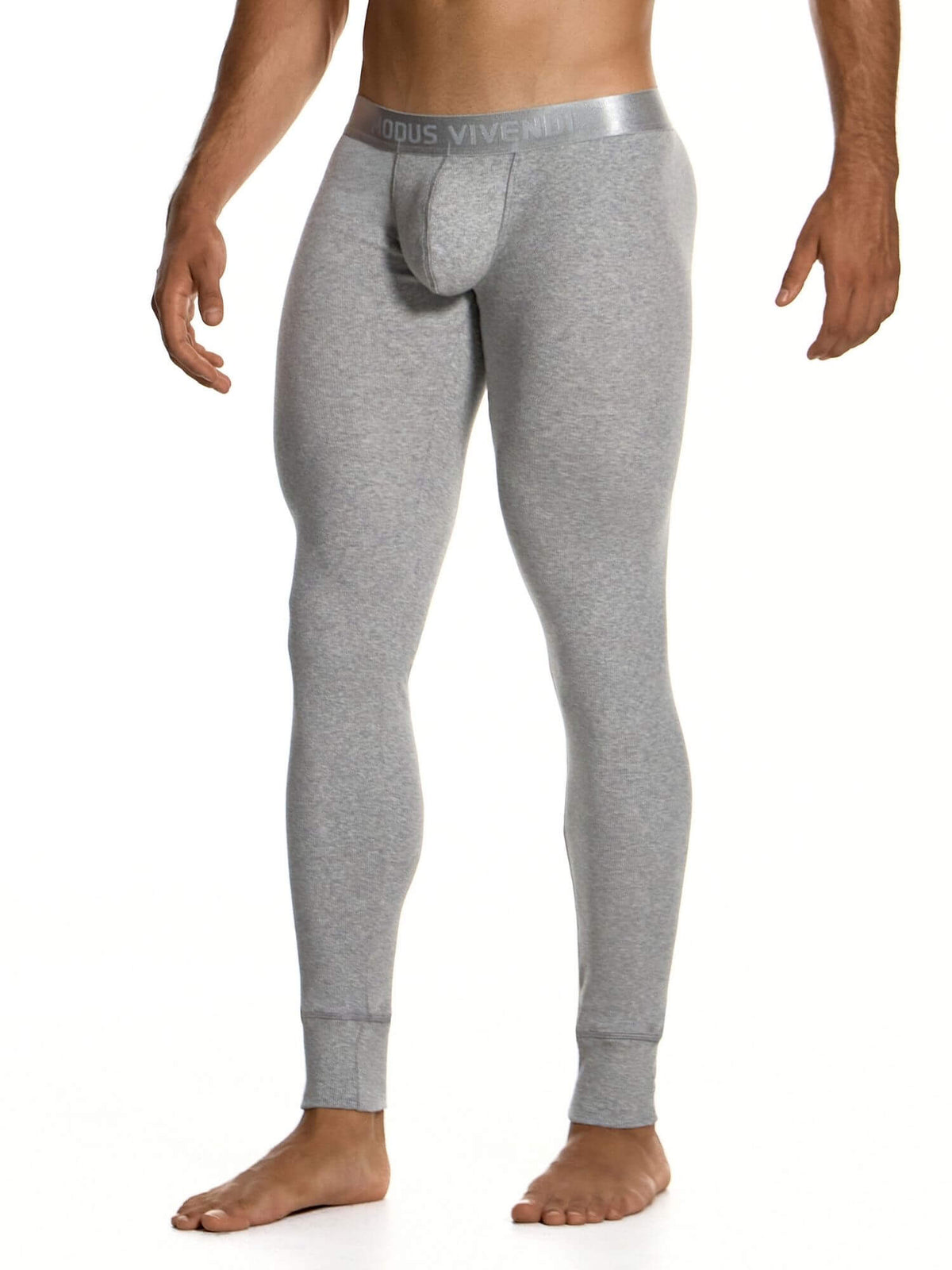 A man wearing heather gray full-length compression underwear with a built-in pouch, shown from the waist down against a plain white background. The waistband features the brand name 