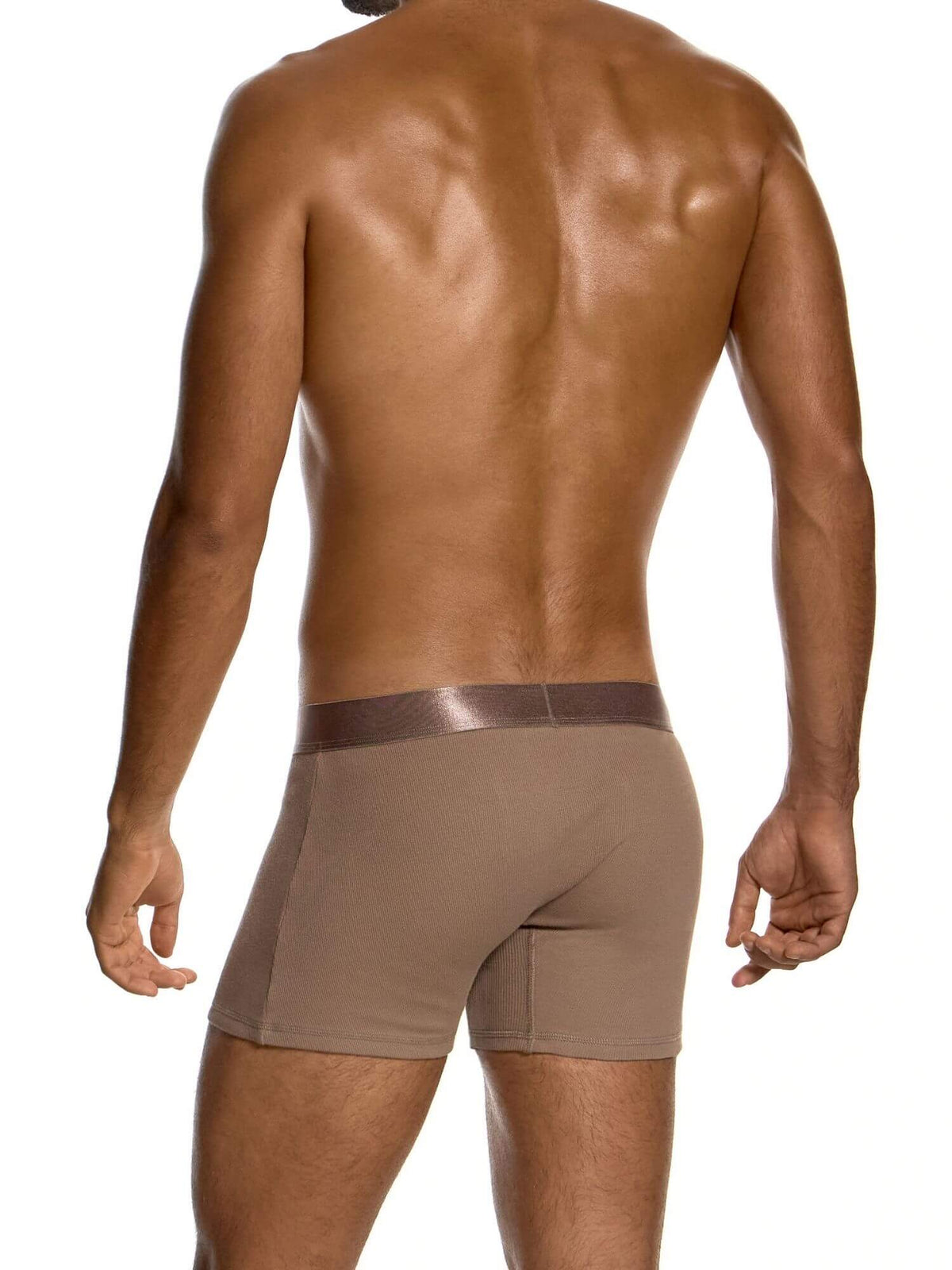 Rear view of a shirtless man wearing tan men's boxer briefs with a darker brown elastic waistband, set against a plain white background.