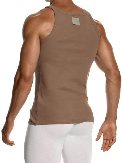 Rear view of a muscular man wearing a brown ribbed tank top and white leggings against a white background.