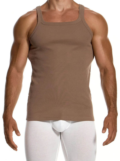 A muscular man wearing a brown tank top and white briefs, shown from the neck down against a plain white background.