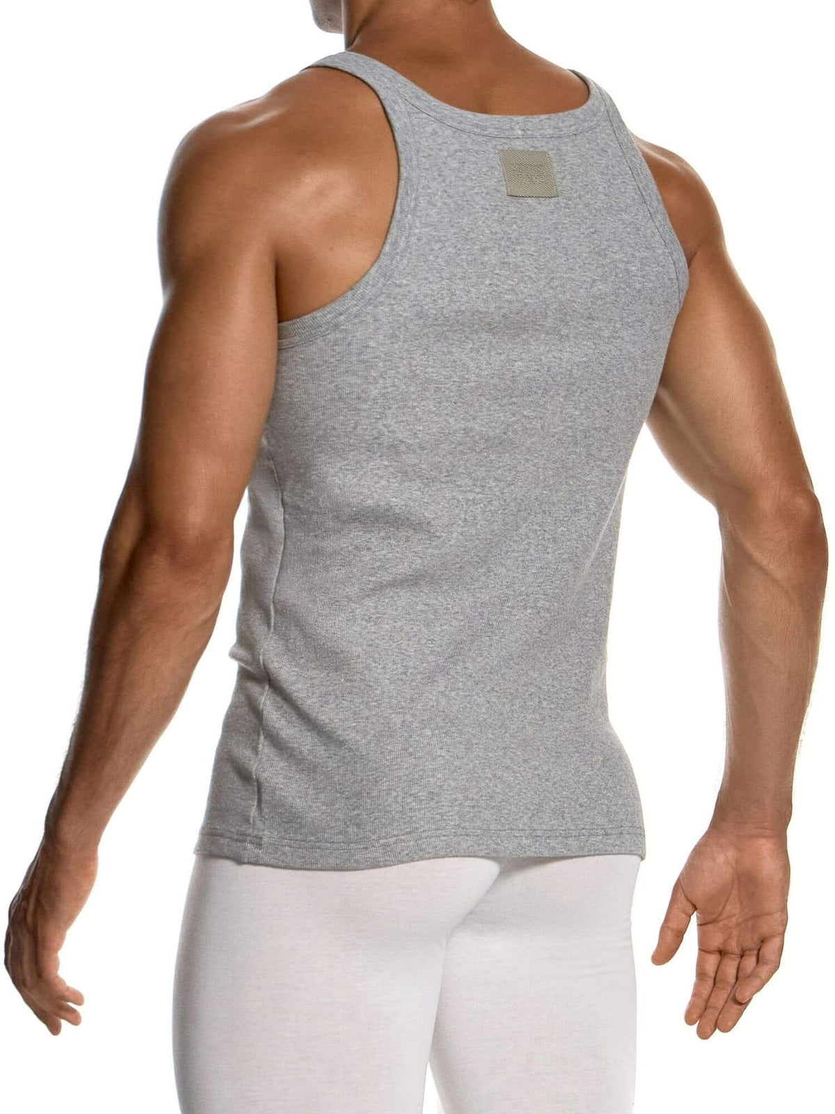 A man wearing a heather gray tank top and white leggings, shown from the back against a plain white background.