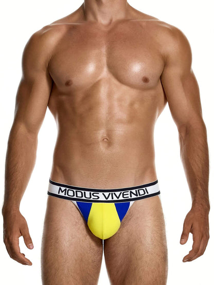 A male model wearing Modus Vivendi athletic briefs with a yellow and blue design and a white waistband with black lettering, set against a plain white background.