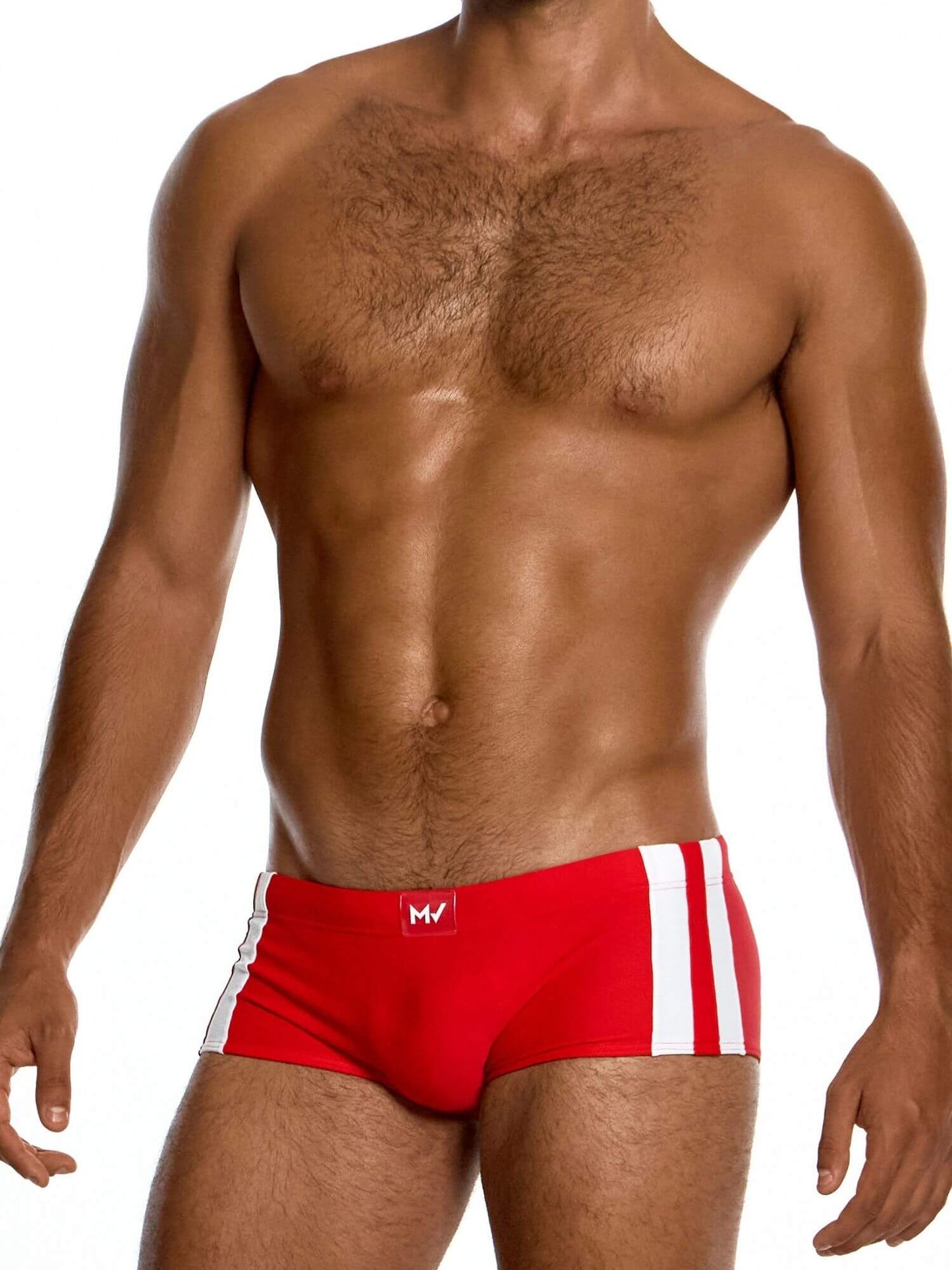Man wearing red swim trunks with a white logo on a white background