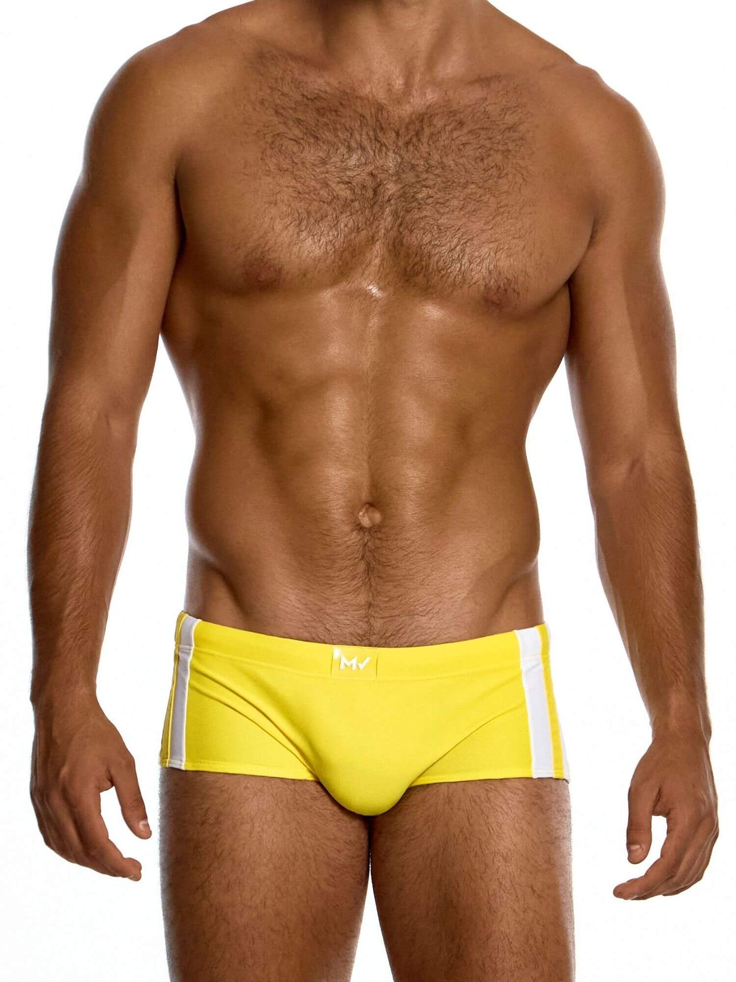 Man wearing a yellow swim brief on a white background