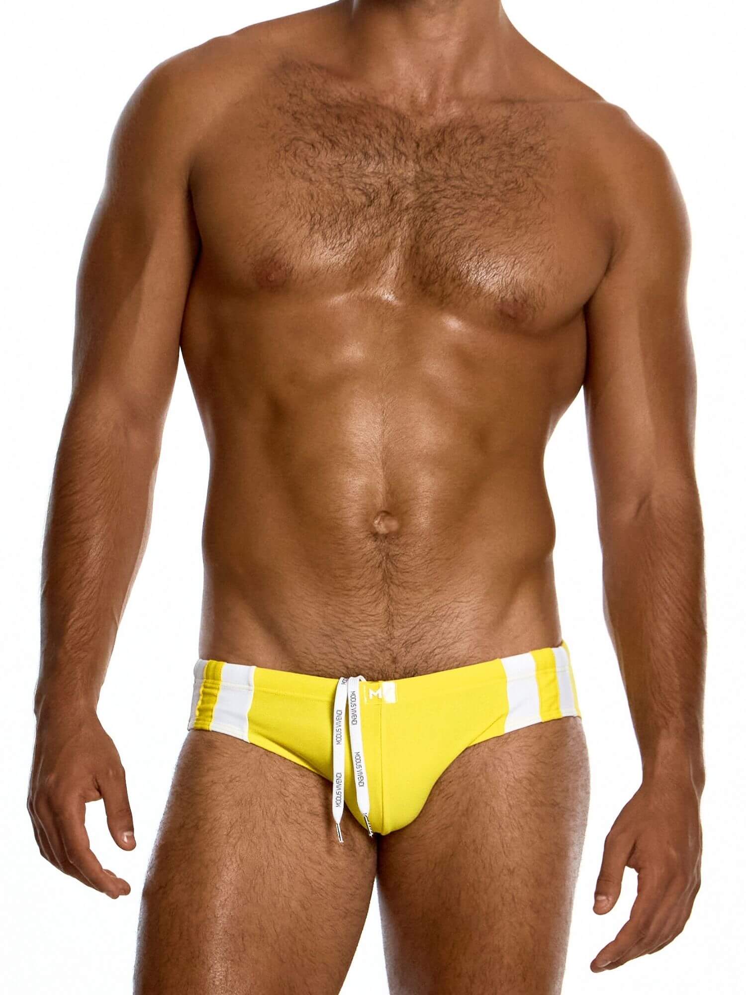 Man wearing a yellow swim suit on a white background