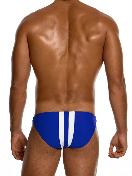 Man wearing a blue swim bikini brief with white stripes on a white background