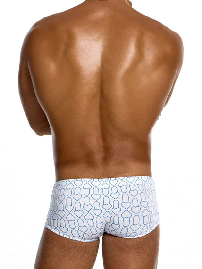 Man wearing white brazil cut swim trunks with blue geometric pattern on a white background