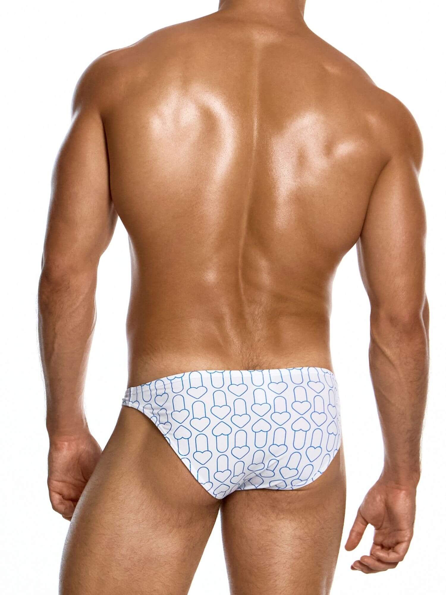 Man wearing a patterned swim bikini  on a white background