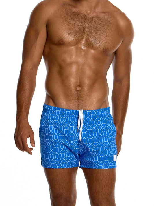 Man wearing blue swim shorts with a geometric pattern on a white background