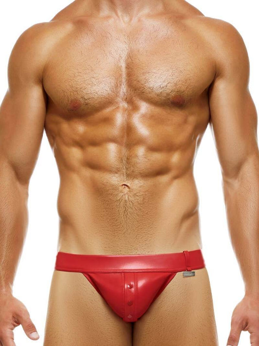 This image features the MODUS VIVENDI Leather Tanga, designed with a sleek, fitted look that emphasizes comfort and style. The tanga is crafted from a high-quality polyester material that mimics the appearance and feel of real leather, boasting a colored body with matching stitching and a waistband, accented by a small metallic Modus Vivendi nickel logo.