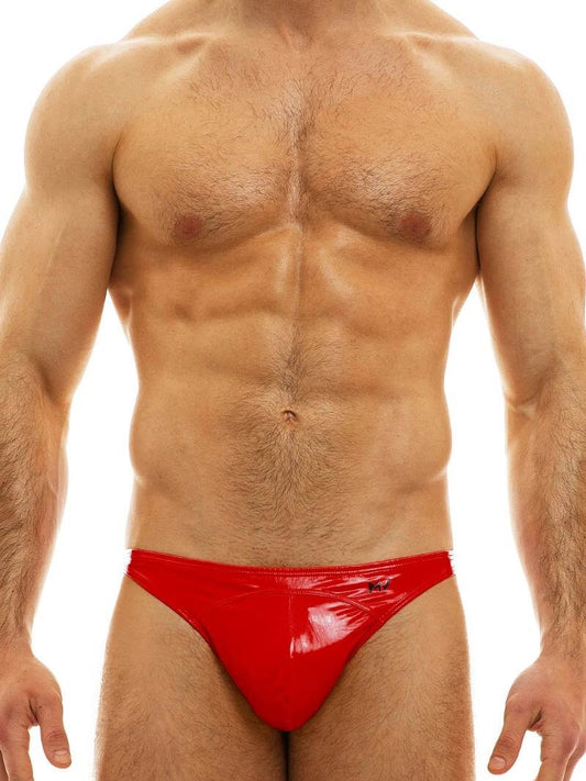 A model wearing a yellow MODUS VIVENDI PVC vinyl mini brief with a low-rise waist and high-cut legs.