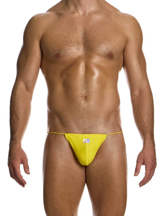 A male model wearing a yellow or mint green swimwear tanga with side tie strings and a shiny holographic Modus Vivendi logo.
