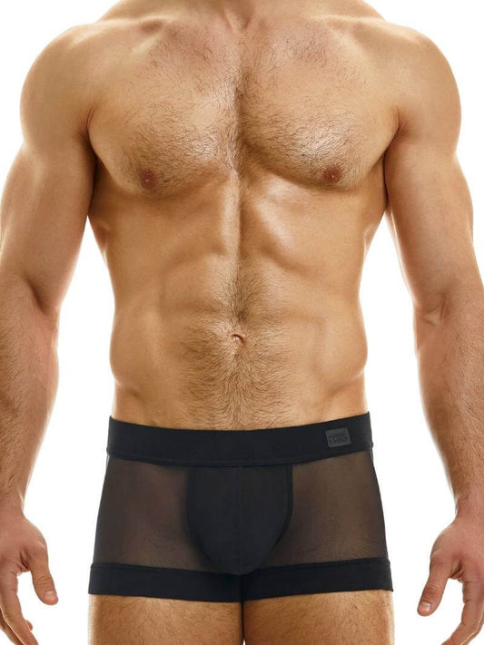 A model wearing white Modus Vivendi sheer muslin boxer briefs with a low-rise waist and a contoured pouch.