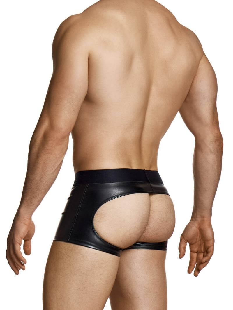 Man wearing a black leather thong on a white background