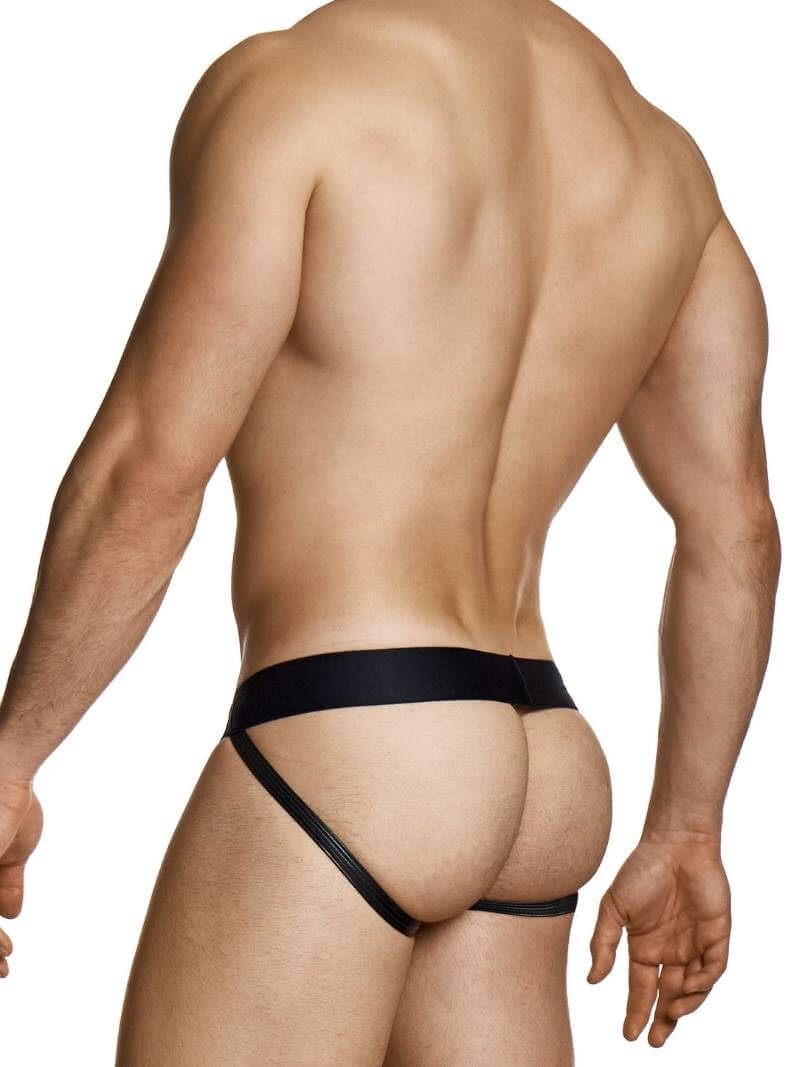 Man wearing a black thong on a white background