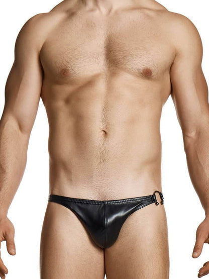 Man wearing a black thong against a white background