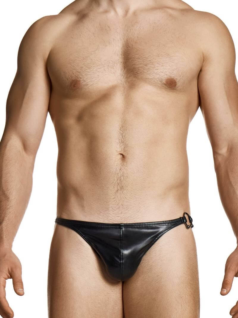 Man wearing a black leather thong against a white background