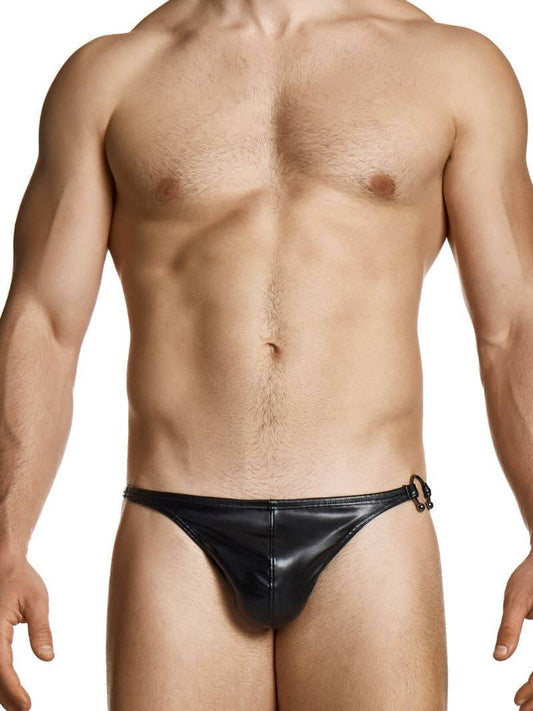 Man wearing a black leather thong against a white background