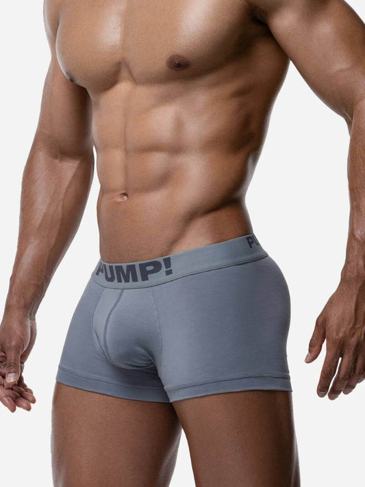 Man wearing gray boxer briefs with 'JUMP!' brand logo on a white background