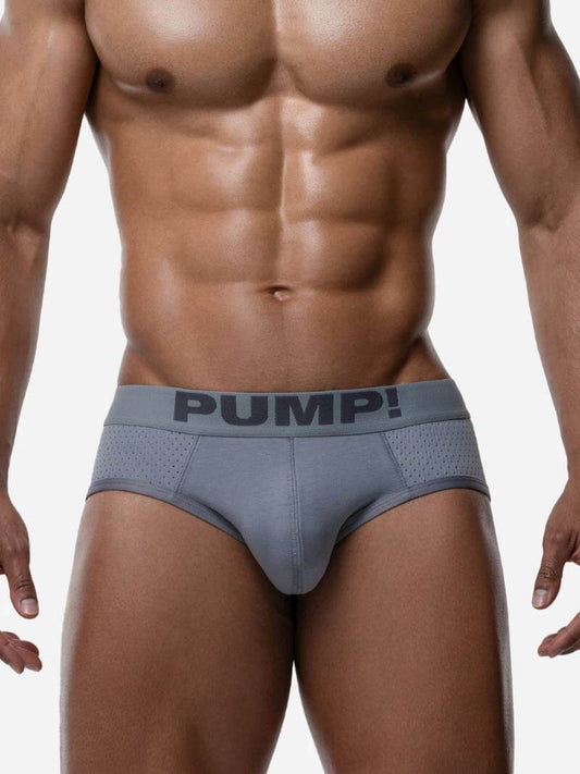Man wearing a gray men's underwear with 'PUMP!' branding on a white background