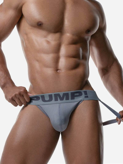 Man wearing a gray men's underwear with 'PUMP!' branding on a white background