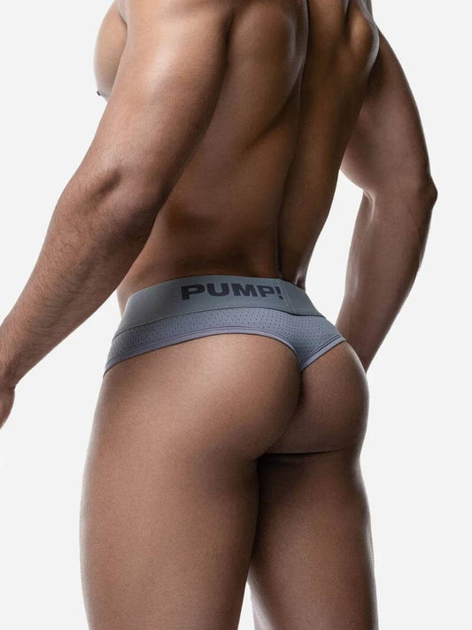 Person wearing a Puma underwear on a plain background
