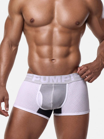 A close-up of a muscular male model wearing white and gray men's boxer briefs with a black accent panel and a gray elastic waistband featuring the brand name 'PUMP!'.