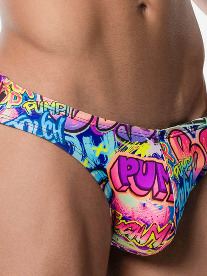 Colorful swim briefs with graphic design on a person against a neutral background