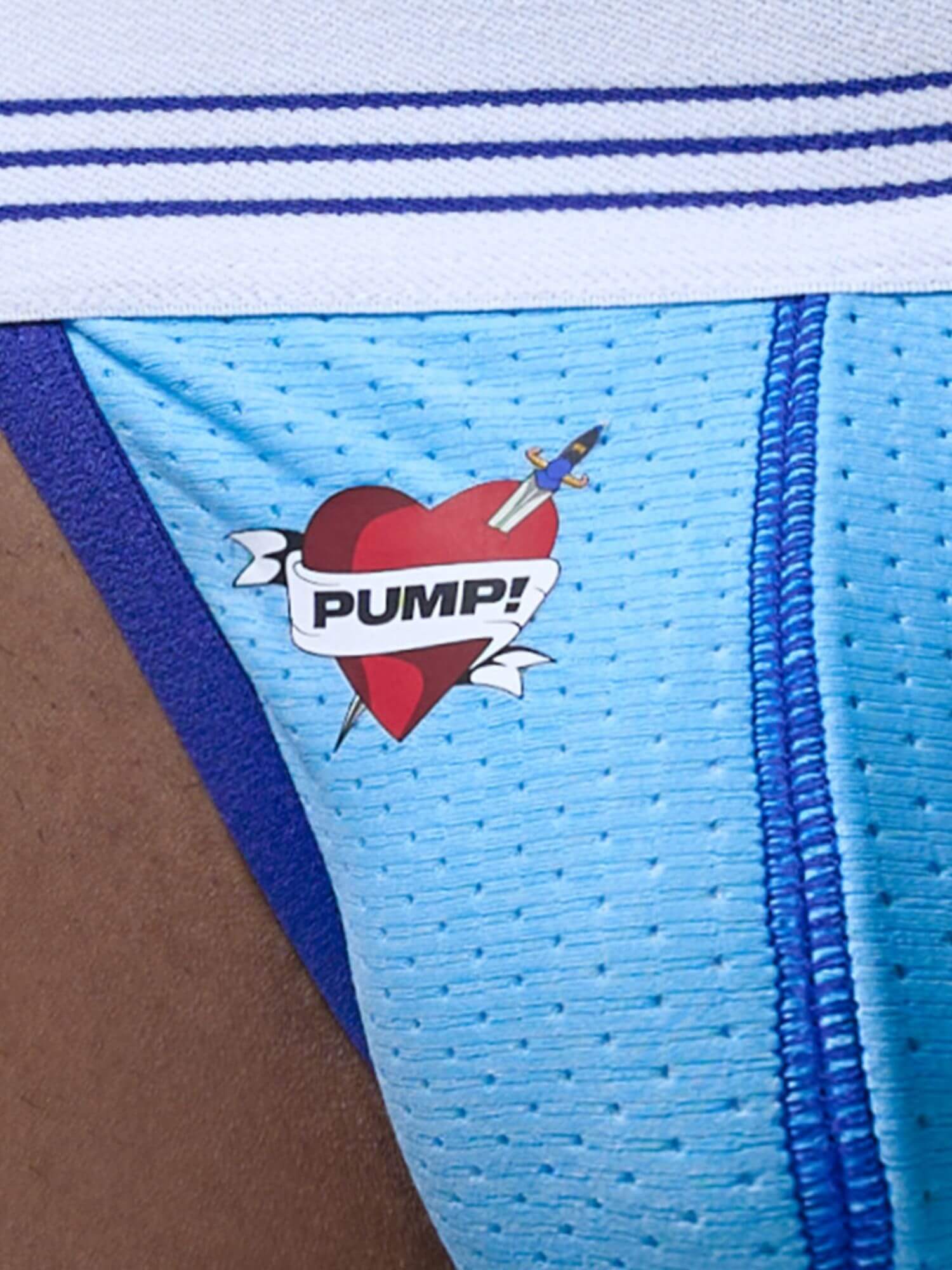 Close-up of a jockstrap with a 'Pump!' logo on a blue and white background.