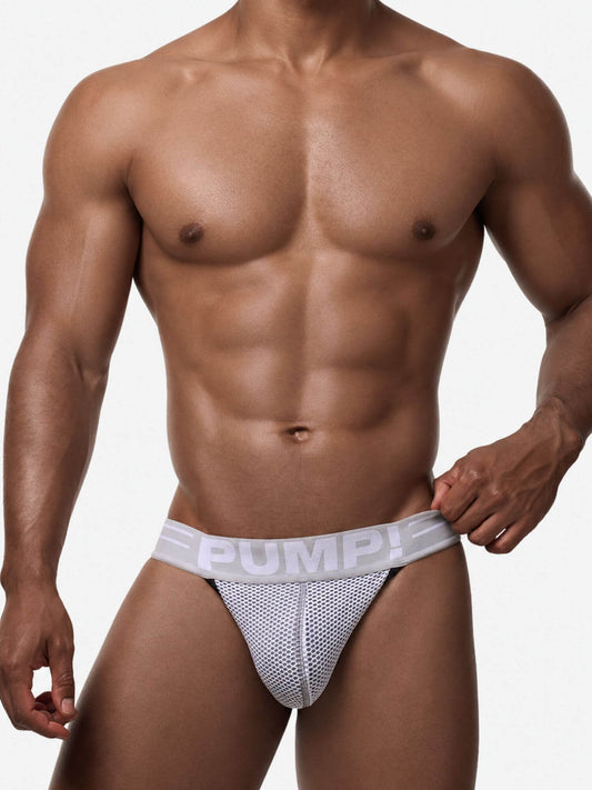 A close-up of a muscular male model wearing a light gray and white mesh brief with a wide light gray waistband featuring the brand name 'PUMP!' in white.