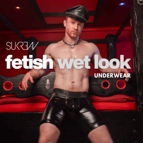 Model wearing sukrew fetish wet look shiny underwear