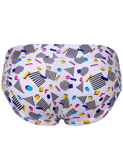 White  briefs featuring a colorful retro geometric pattern with black stripes, yellow, pink, blue, and orange shapes.