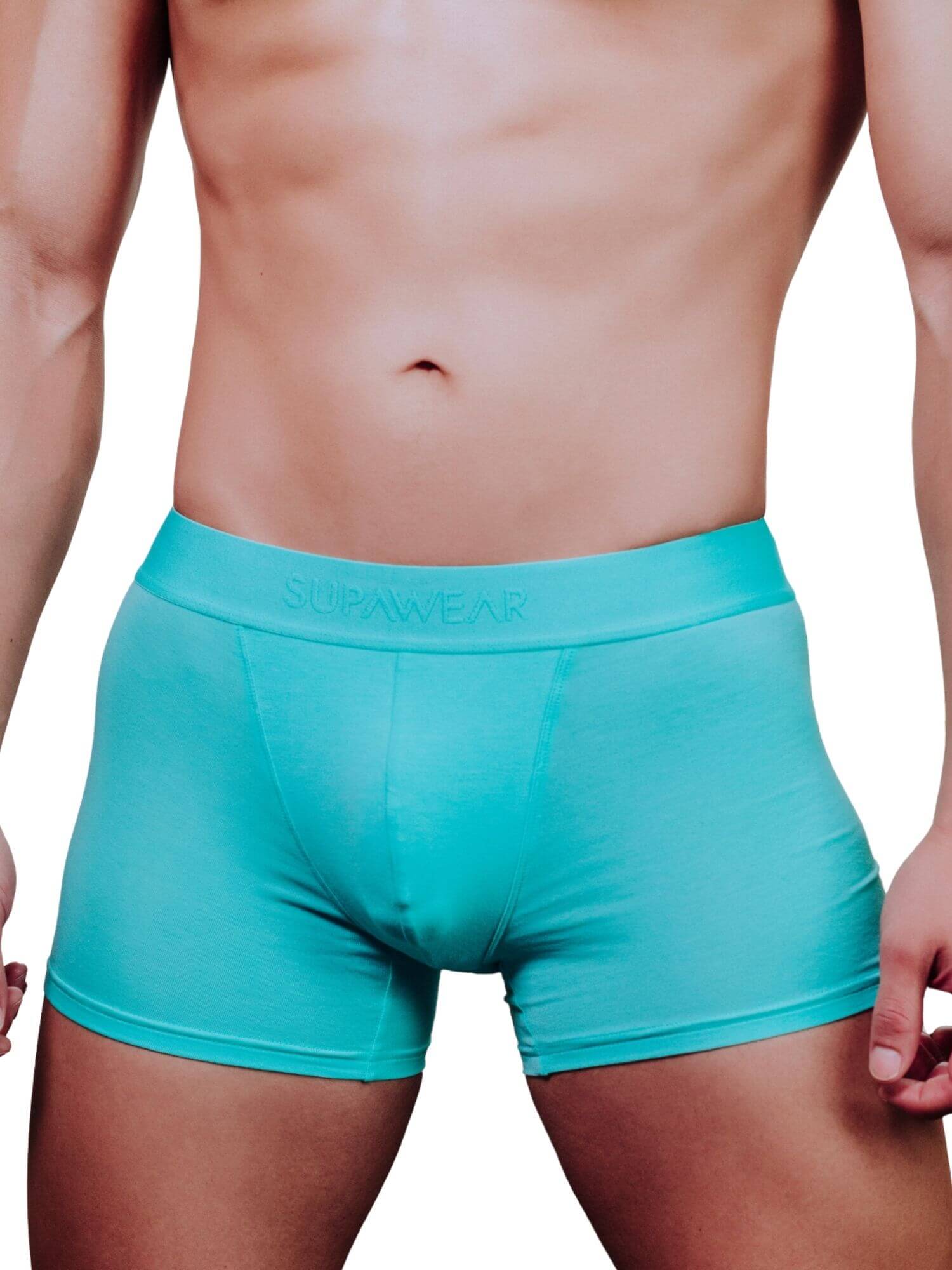A close-up of a male model's lower torso wearing turquoise boxer briefs with the brand name 'SUPAWEAR' printed on the waistband, set against a plain white background.