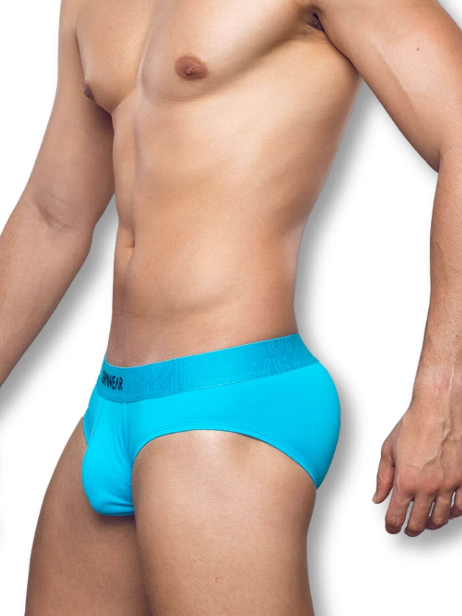 Man wearing bright blue underwear on a white background