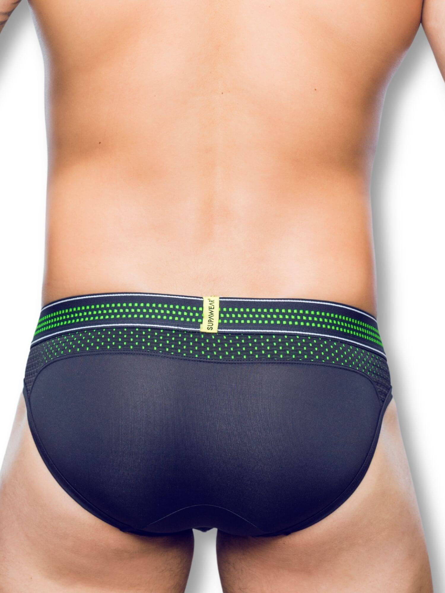 person wearing black men's underwear with green waistband on a white background