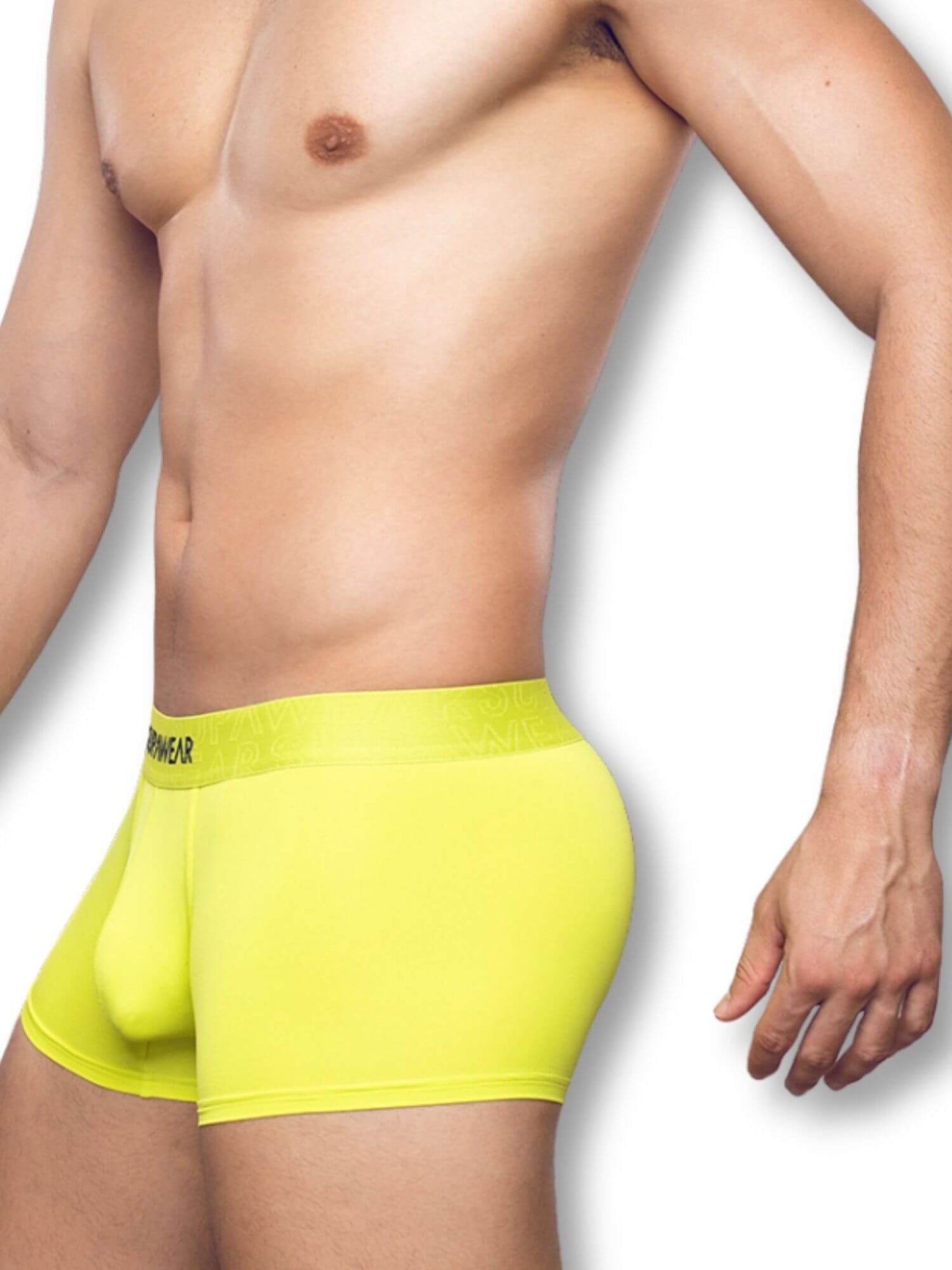 Man wearing bright yellow boxer briefs on a white background