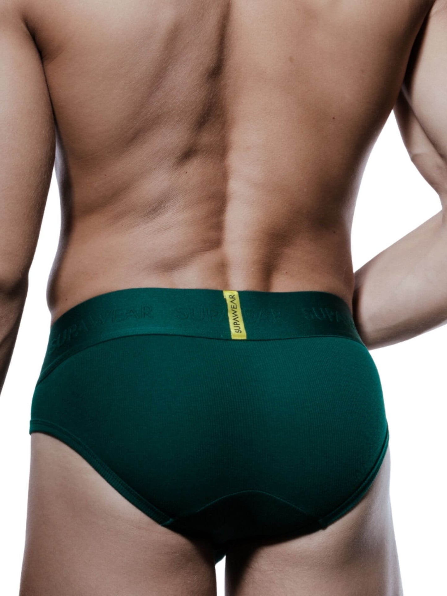 Rear view of a man wearing dark green men's briefs with a yellow waistband label.