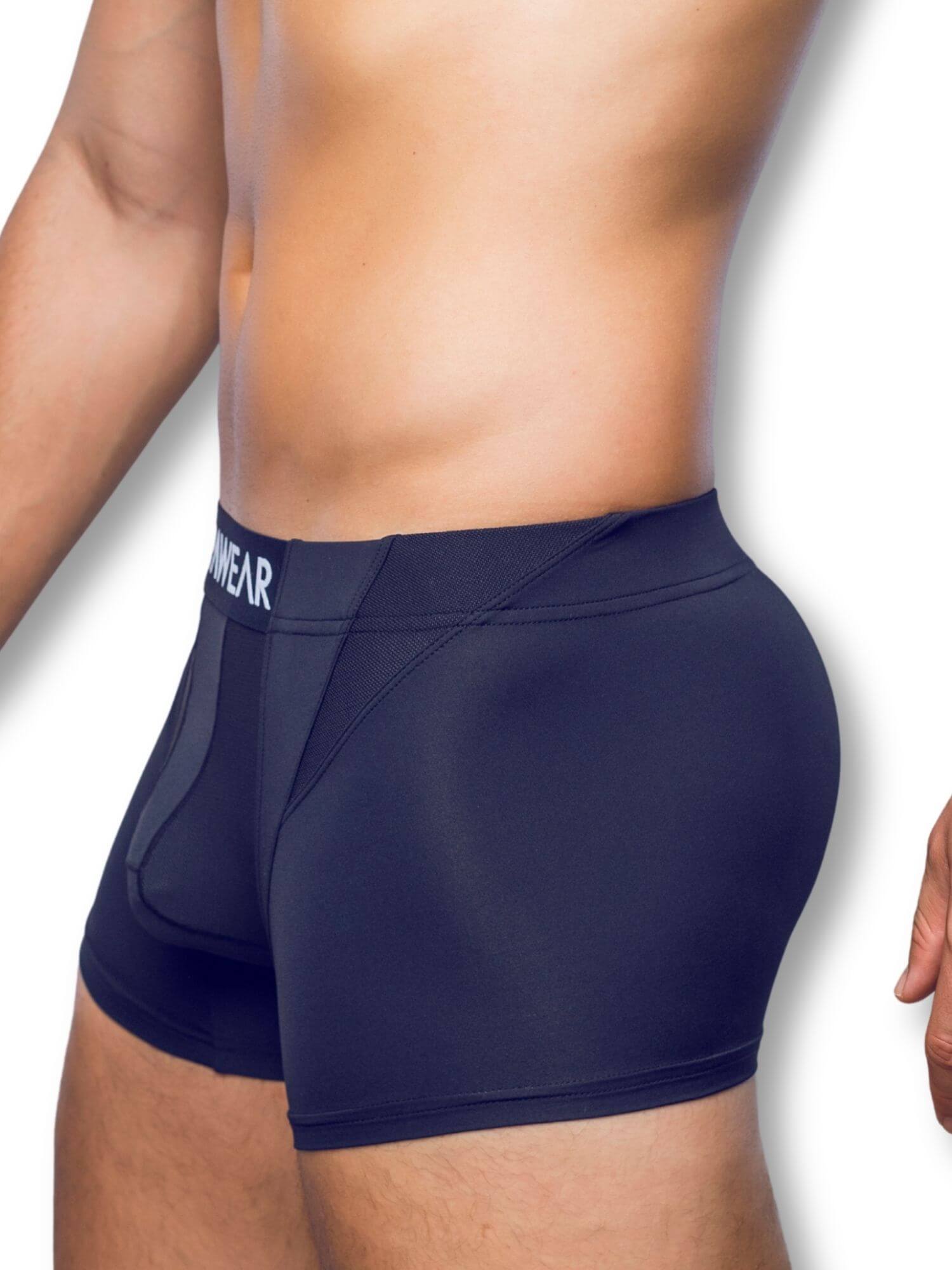 black underwear worn by a person on a white background