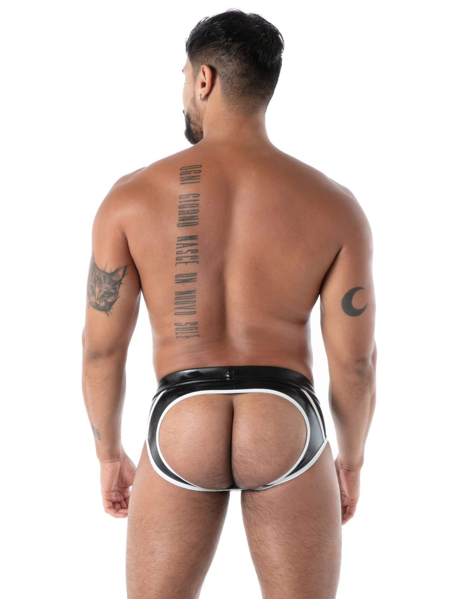 Man wearing a black and white  latex underwear on a white background